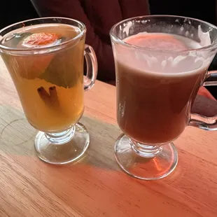 two glasses of beer on a wooden table