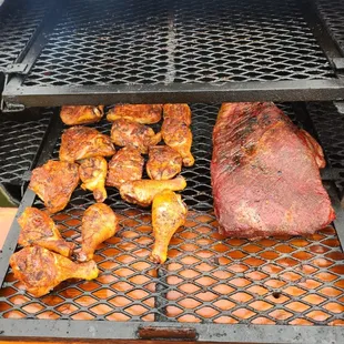 the meat being cooked on the grill