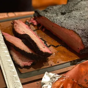 a bbq pulled pork on a cutting board