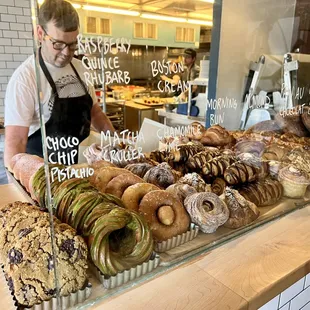 a baker working behind a counter