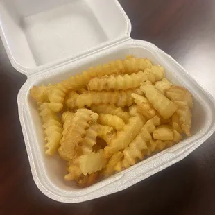 french fries in a styrofoam container