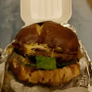 a sandwich with meat, cheese, and lettuce