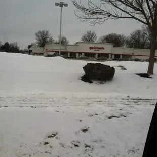 a pile of snow in a parking lot