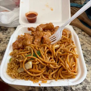 a plate of noodles and meat