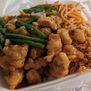chicken, rice, and green beans in a styrofoam container