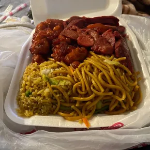 Combo B with half rice and half chow mein, orange chicken, and BBQ pork.