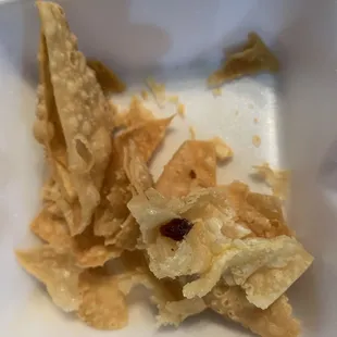 a plate of food left in a styrofoam container