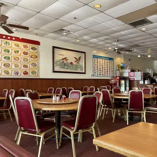 a dining area with tables and chairs