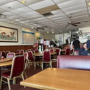 the dining area with tables and chairs