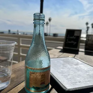 a glass of water and a book