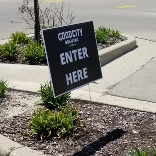 a sign on the corner of a street