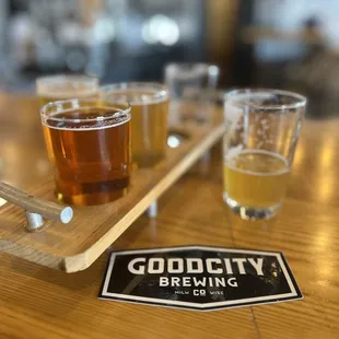 a flight of beers on a table