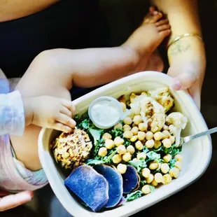a woman holding a baby