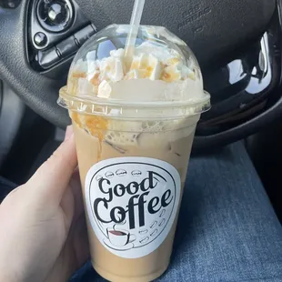 a hand holding a cup of coffee