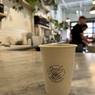 a cup of coffee on a counter