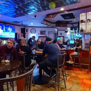 people sitting at the bar