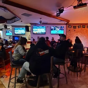 people sitting at the bar