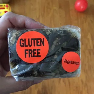 a person holding a bag of gluten free chocolate