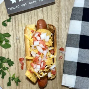 a hot dog with toppings