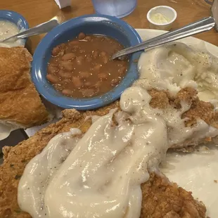 Senior Pork Chops ( fried) , potatoes , pinto beans  and plenty cream gravy !! And what a deal 9.99