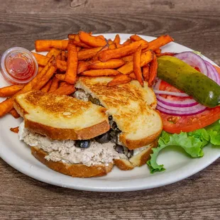 Nick's Nutty Tuna Thing - tuna, cream cheese, black olives, chopped up pickles, and jalapenos.