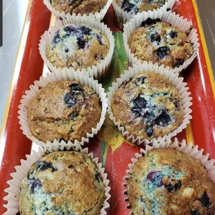 a tray of blueberry muffins