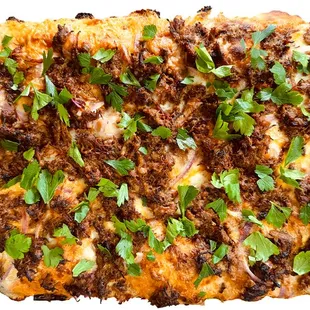 Sweet &amp; tangy bbq sauce, red onion, mozzarella and cheddar cheese, bbq brisket, topped with fresh parsley and hot honey.