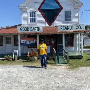 a man standing in front of a building