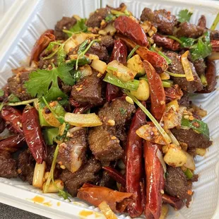beef and peppers in a styrofoam container