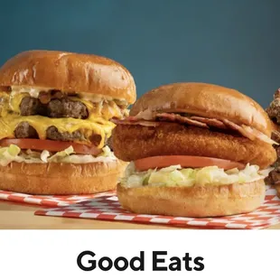a variety of burgers on a table