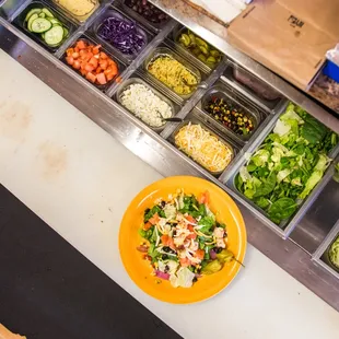 a plate of salad on a counter