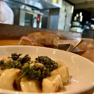 a bowl of pasta and bread