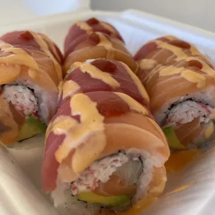 a plate of sushi rolls