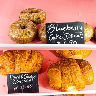 Blueberry cake donut and ham and cheese croissant