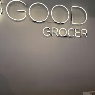 a neon sign on a wall