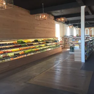 a grocery store filled with fruits and vegetables