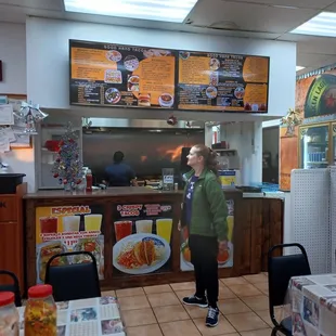 a woman standing in a restaurant
