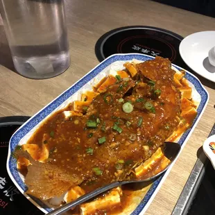 "Watercress Fish" on menu  (clearly a mistranslation since there is obviously no watercress here. it's a whole fish over a bed of tofu.)