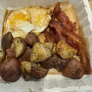 Eggs (I popped the yolk), bacon, and potatoes