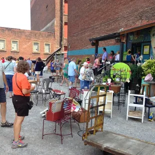 A fine spring day of customers shopping outside while waiting to get in.