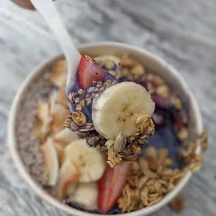 a bowl of fruit and granola