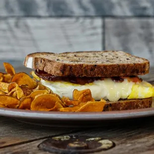 a breakfast sandwich and chips