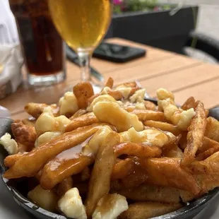 This is a picture I took in Montreal Canada where poutine originated. You should be able to distinguish the cheese curds.