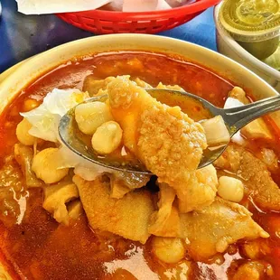 a bowl of soup with a spoon in it