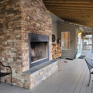 a patio with a fireplace