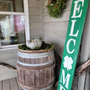 a welcome sign on a porch