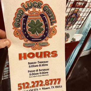 Menu with hours and phone number