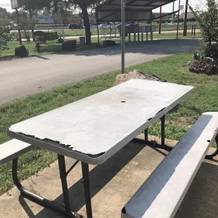 The picnic table provided and the residential mailboxes