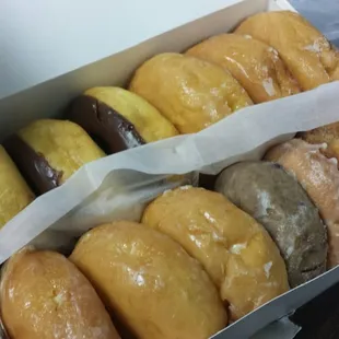 Plenty of assorted flavored donuts, as well as apple fritters and yummy cinnamon rolls!