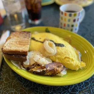 Vegetarian omelette, breakfast potatoes, and wheat toast.